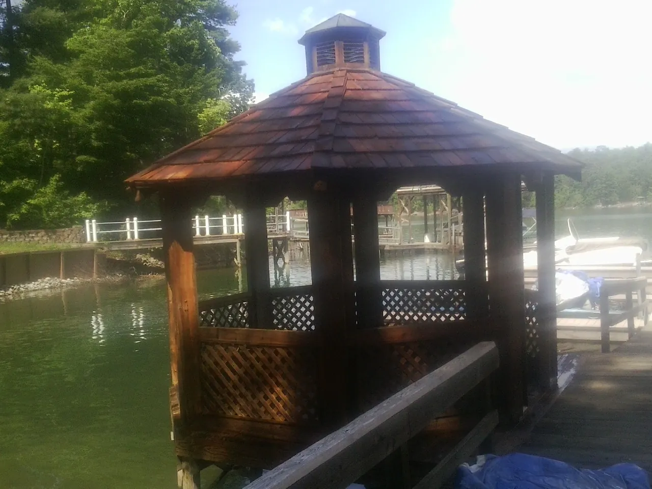 Cedar shake gazebo roof rebuilt on a lake dock in Smartsville